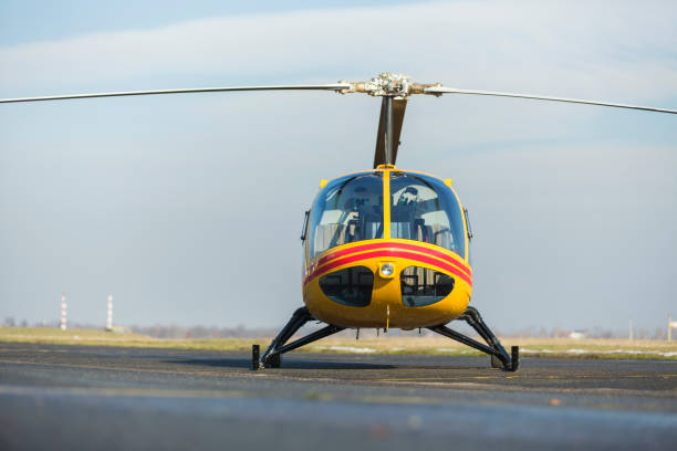 istock Helicopter rescue. Yellow helicopter on runway.  All logos and text removed. 821482064