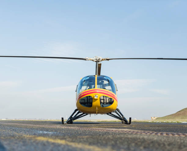 istock Helicopter rescue. Yellow helicopter on runway.  All logos and text removed. 821482096