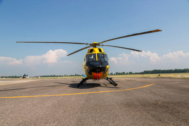 istock Helicopter rescue. Yellow helicopter on runway.  All logos and text removed. 821482140