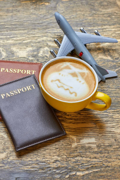 istock Coffee, passports and toy plane. 821482168