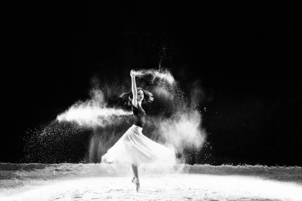 istock Beautiful ballet dancer, dancing with powder on stage 821494656