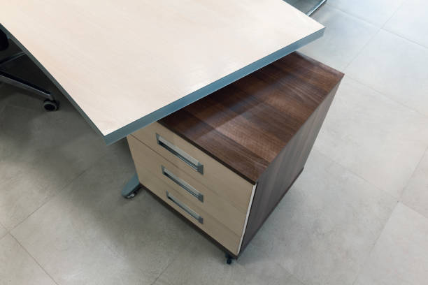 istock wooden table detail in office 821494664