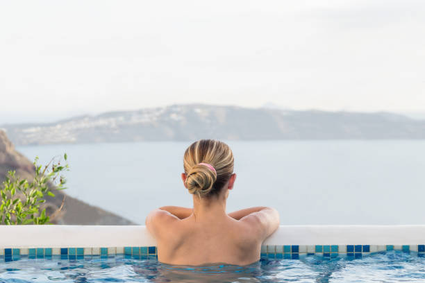 istock Woman relaxing in pool 821497064