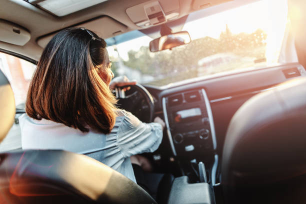 istock woman driving car 821502248