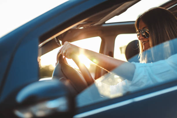 istock woman driving car 821506632