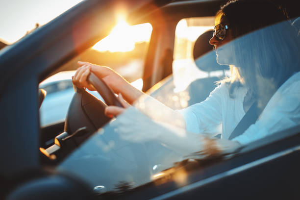 istock woman driving car 821509642