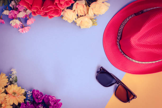 istock Flat lay hat and sunglasses with flowers on top table 821513358