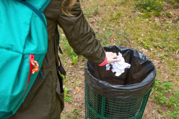 istock The modern person who is throwing out garbage in a package in a basket. 821513902