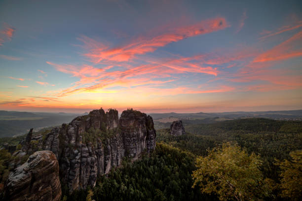 istock Sunset in Schrammstein, forests and colored sky in the Germany Switzerland. 821520458
