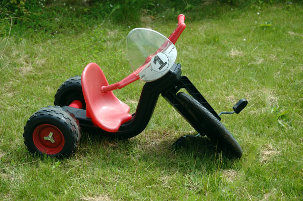 istock Children bicycles on a green lawn 821520568