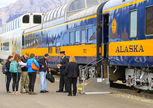 Denali National Park, Alaska: Alaska Railroad Train waiting at Denali Station. Passenger get in the railway car.