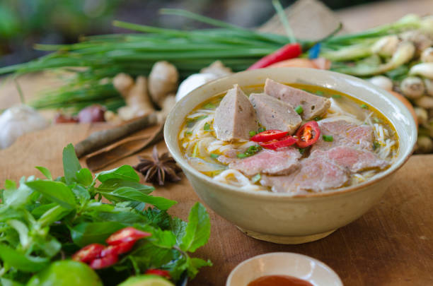 istock Vietnamese pho soup with beef, meatball, fresh vegetable 821524330