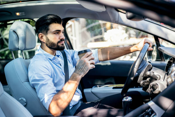 istock Businessman driving a car 821528164