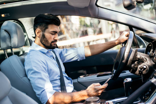 istock Businessman driving a car 821528314