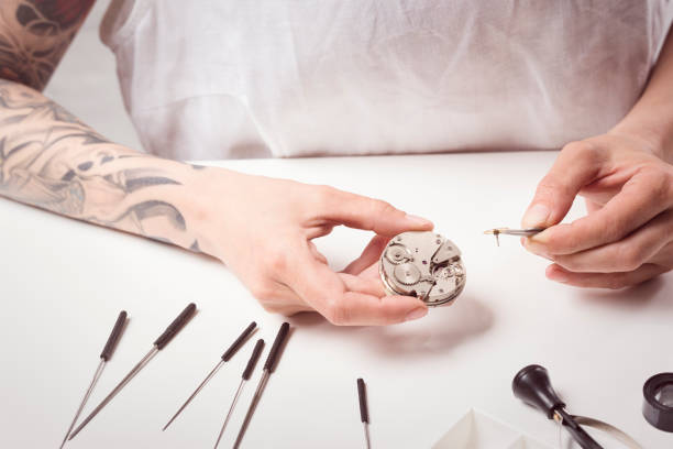 istock Close Up Portrait of a Female Watchmaker at Work 821528548
