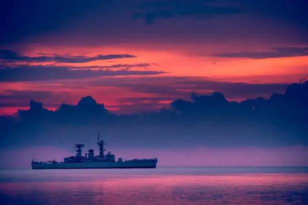 Photo of war ship sunset, Beautiful sunset on the beach, Sunset lake landscape