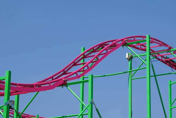 istock Rollercoaster track rail against a brilliant blue sky 821536900