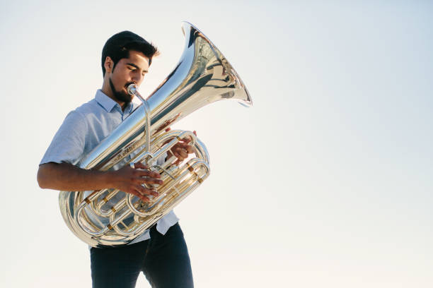 musician playing tuba musician playing tuba man trumpet stock pictures, royalty-free photos & images