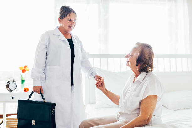 istock Providing care for elderly. Doctor visiting elderly patient at home. 821537590