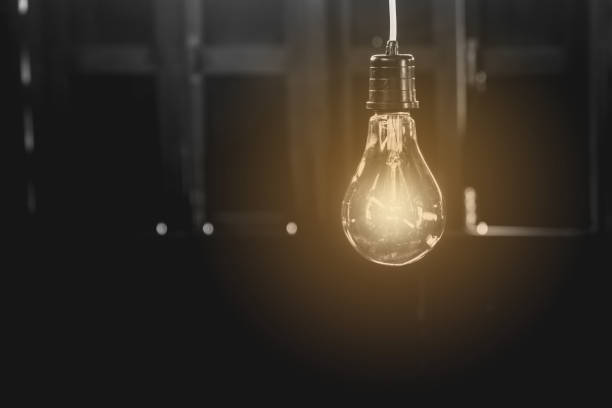 istock Hanging light bulbs with glowing one. Idea and creativity concept with light bulbs. 821540758