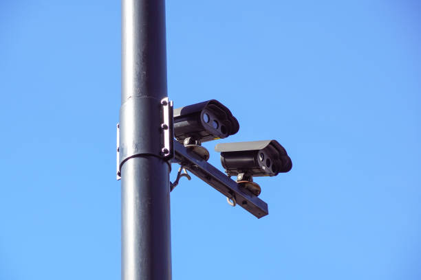 istock CCTV security camera and surveillance on a pole against the backdrop of blue sky 821543308