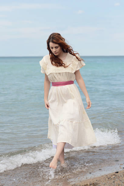 istock vintage woman playing on the beach 821543876