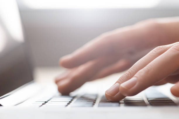 istock Hands typing on laptop keyboard close up 821544118