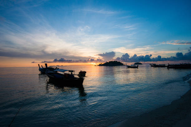 istock Beautiful sunset and Thai boats 821544780
