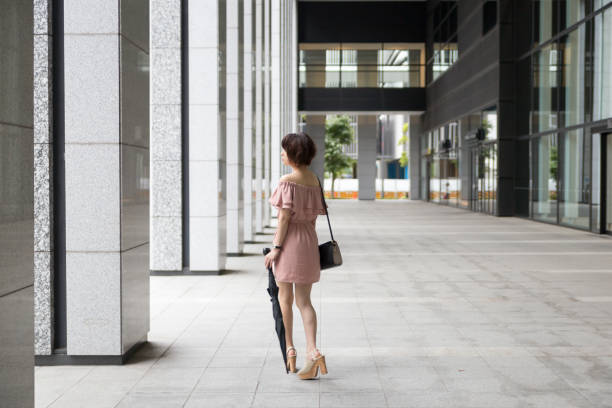 istock cute Japanese woman riding the escalator 821548772