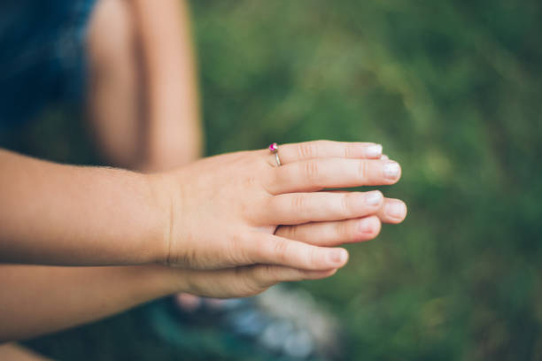 istock Mother and daughter hands close up 821551212