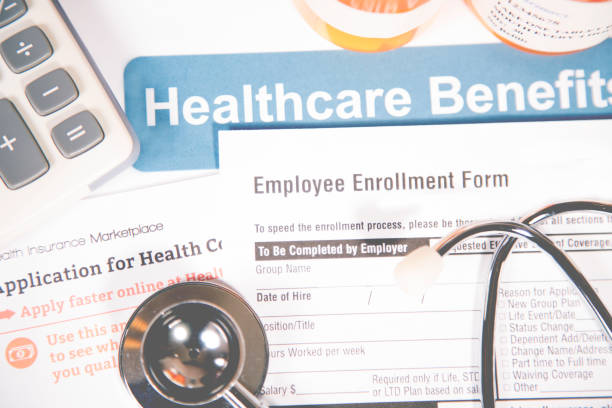 istock Open enrollment healthcare benefit forms. 821551324