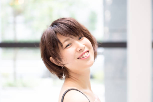 istock cute Japanese woman riding the escalator 821551418