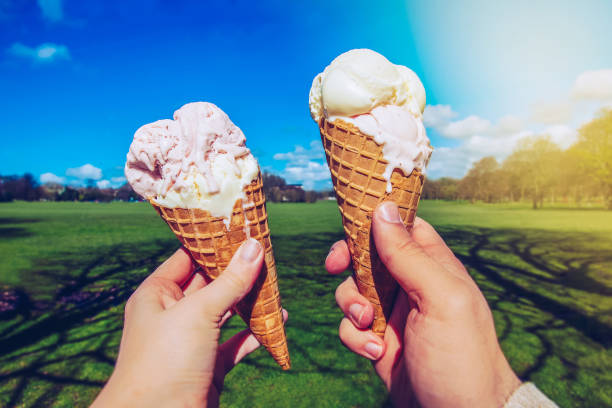 istock Young couple with Ice Creams in the park. 821555152