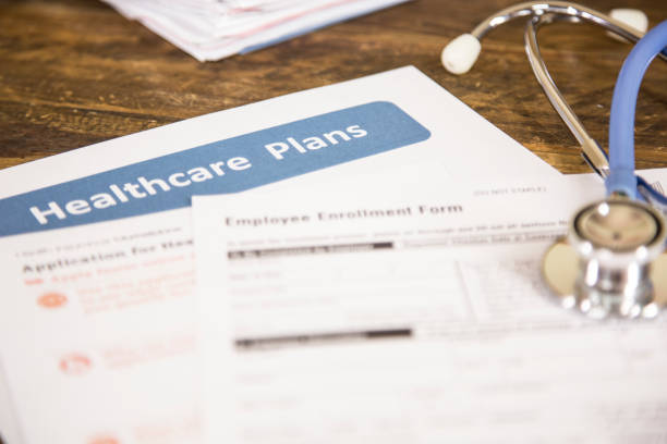 istock Open enrollment healthcare benefit forms. 821558950