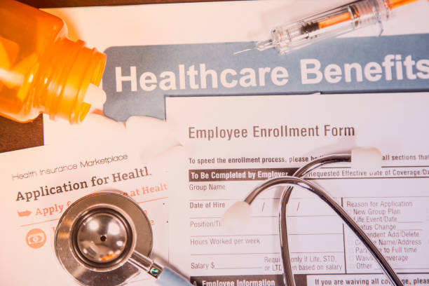 istock Open enrollment healthcare benefit forms. 821559148