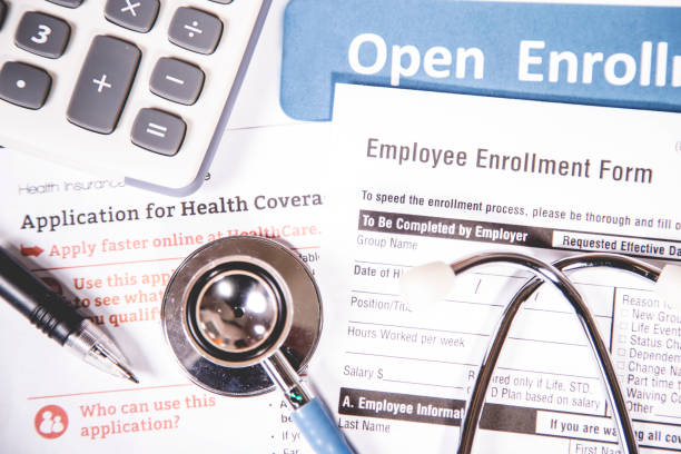 istock Open enrollment healthcare benefit forms. 821561584
