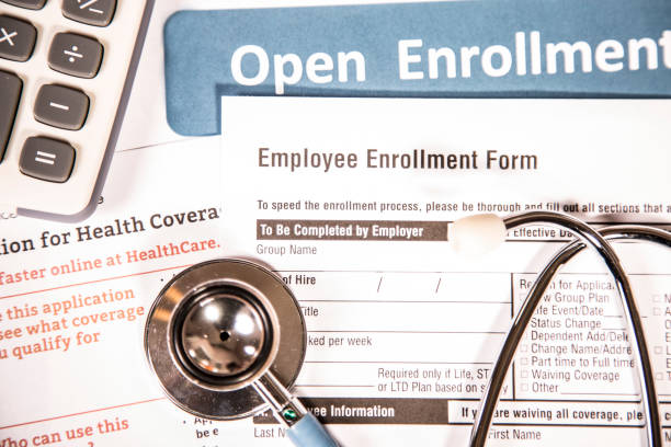 istock Open enrollment healthcare benefit forms. 821561798