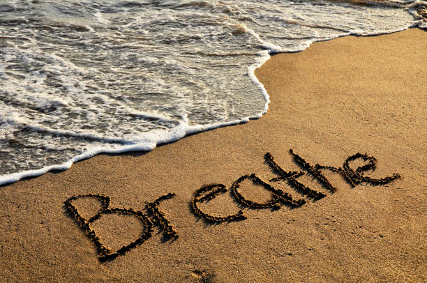 Breathe Word breathe on sunset beach breathing exercise photos stock pictures, royalty-free photos & images