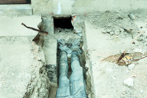 istock District heating pipelines connected to a residential building through the pit in the foundation base. 821565574