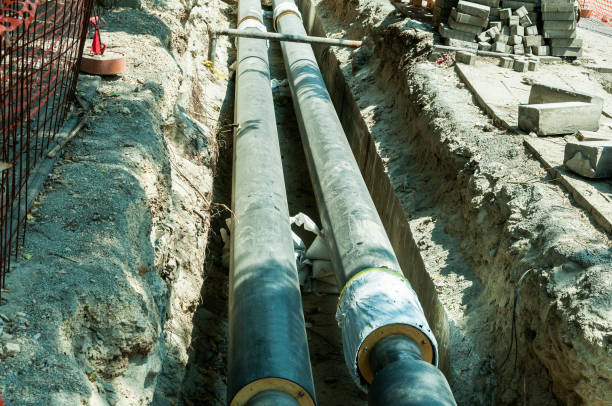 istock District heating pipeline reparation and reconstruction underground parallel with the street. 821565724