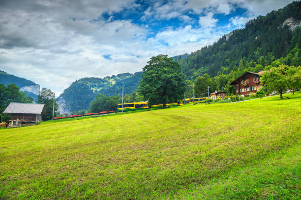 famous lauterbrunnen town landscape, bernese oberland, switzerland, europe - interlaken railroad station train rural scene imagens e fotografias de stock