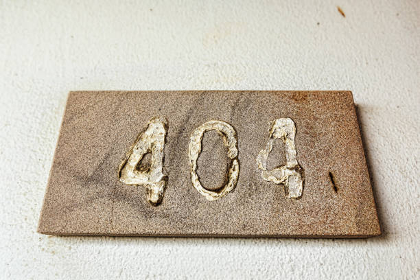 istock Error 404 number plate in abandoned building on the old wall 821569288
