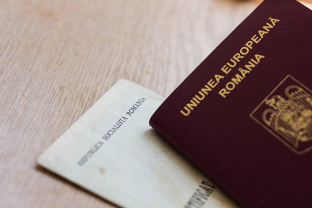 istock Romanian Passport and old birth certificate 821575346