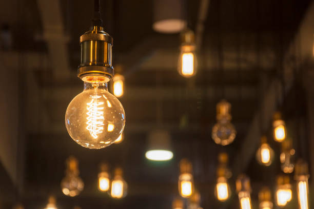 istock Retro / Vintage lighting bulbs hanging for decorative 821593600