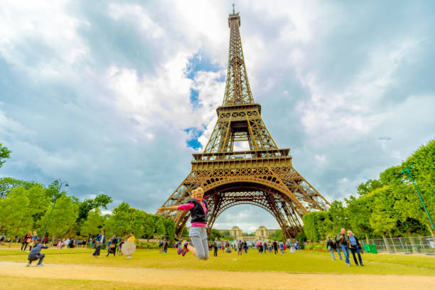 istock Woman jumping at Tour Eiffel 821594554