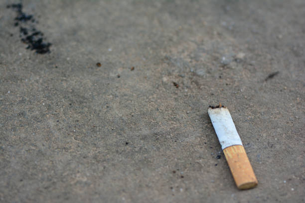 istock Used cigarette on the cemen floor 821594638
