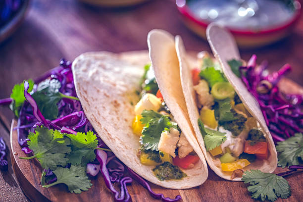 istock Preparing Mexican Tacos with Spicy Salsa and Shrimps 821595680
