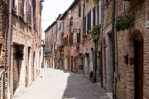 Narrow street of a village of umbria and tuscany stock photo