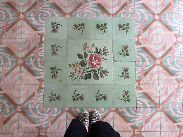 istock Feet over vintage tiled floor 821601770