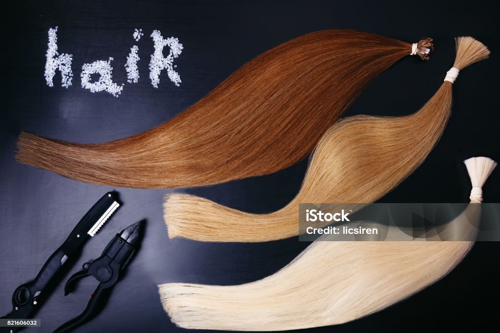 Set Of Of Three Colors Hair Extension Tools On A Dark Background Copyspace  Top View Stock Photo - Download Image Now - iStock